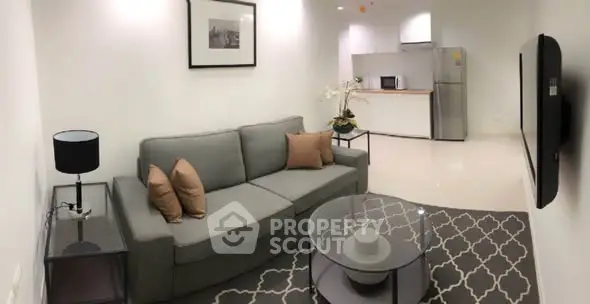 Modern living room with stylish decor and open kitchen layout