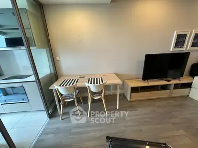 Modern living room with sleek furniture and open kitchen layout