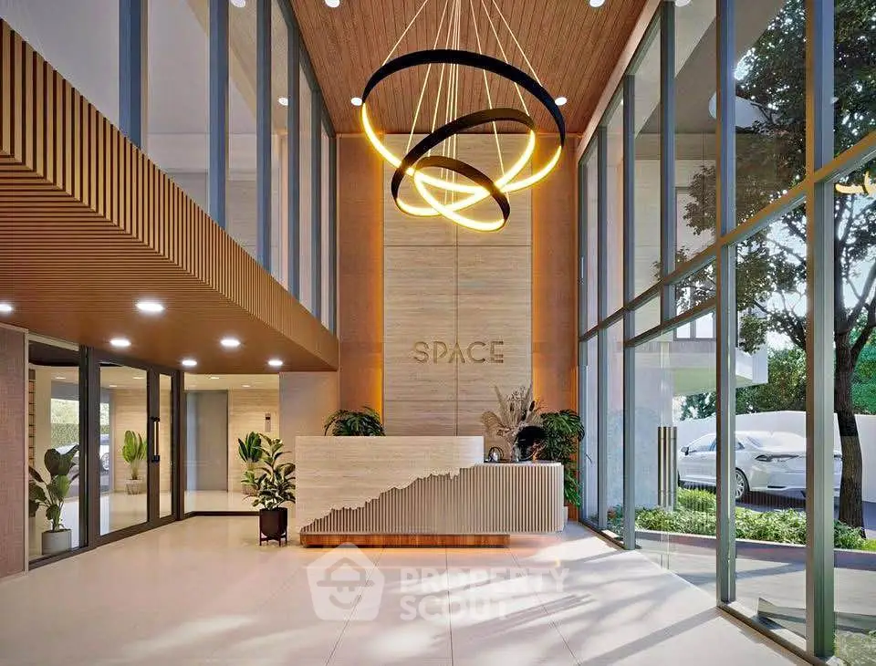 Luxurious modern building entrance with elegant lighting and glass walls