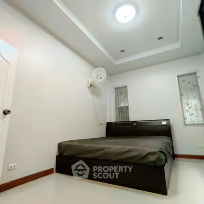 Spacious bedroom with modern design and cozy lighting