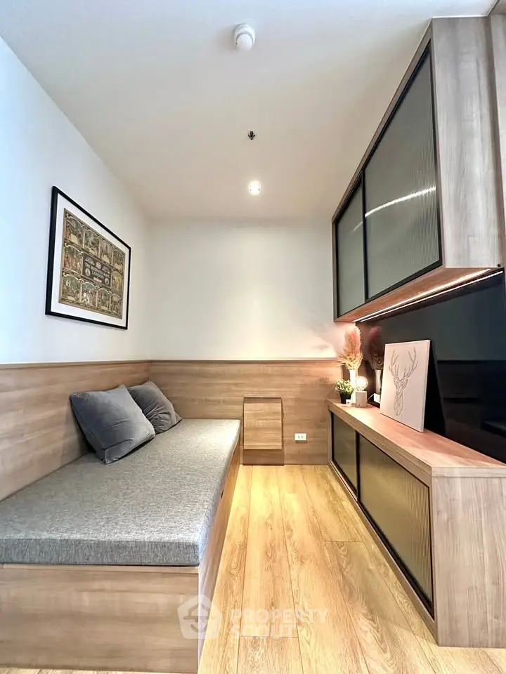 Modern living room with stylish wooden furniture and cozy seating area.