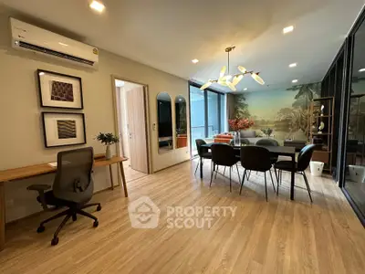 Modern dining area with stylish decor and large windows in a contemporary apartment.