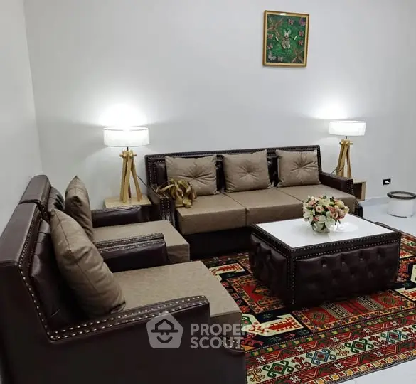 Elegant living room with stylish leather sofas and vibrant carpet