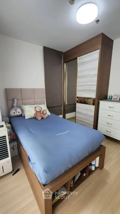 Cozy bedroom with modern furniture and ample storage space