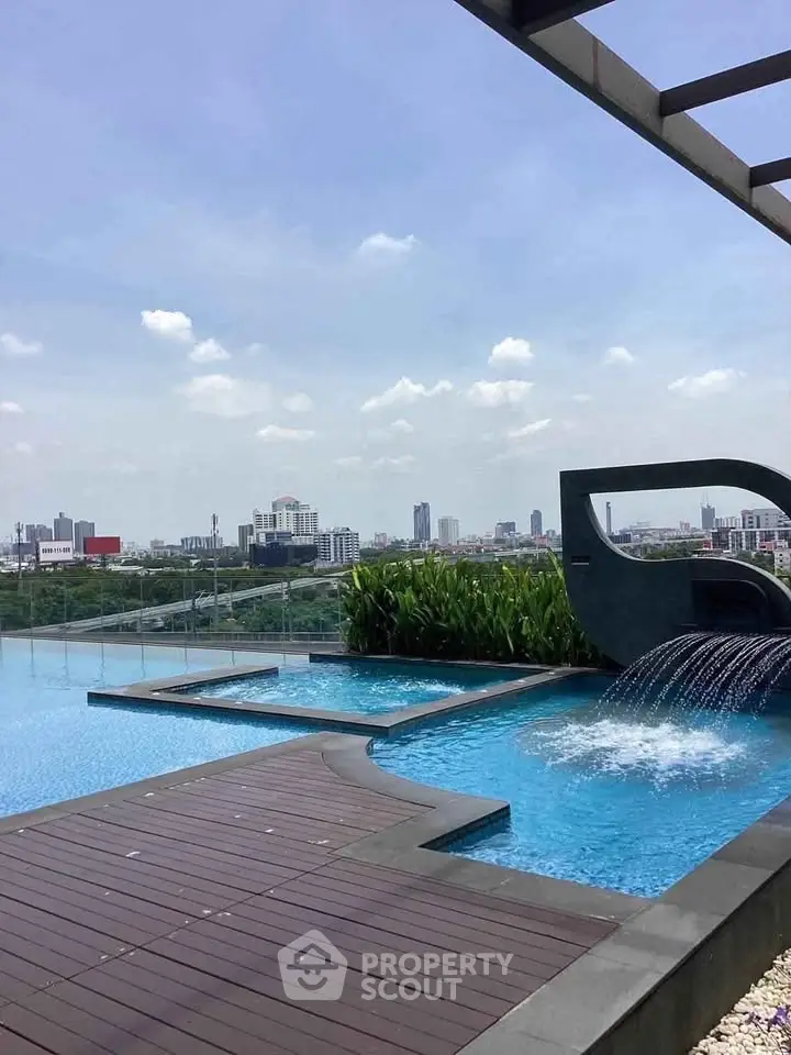 Luxurious rooftop pool with stunning city skyline view, perfect for relaxation and leisure.