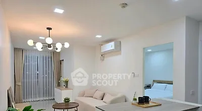 Modern living room with elegant lighting and cozy seating area