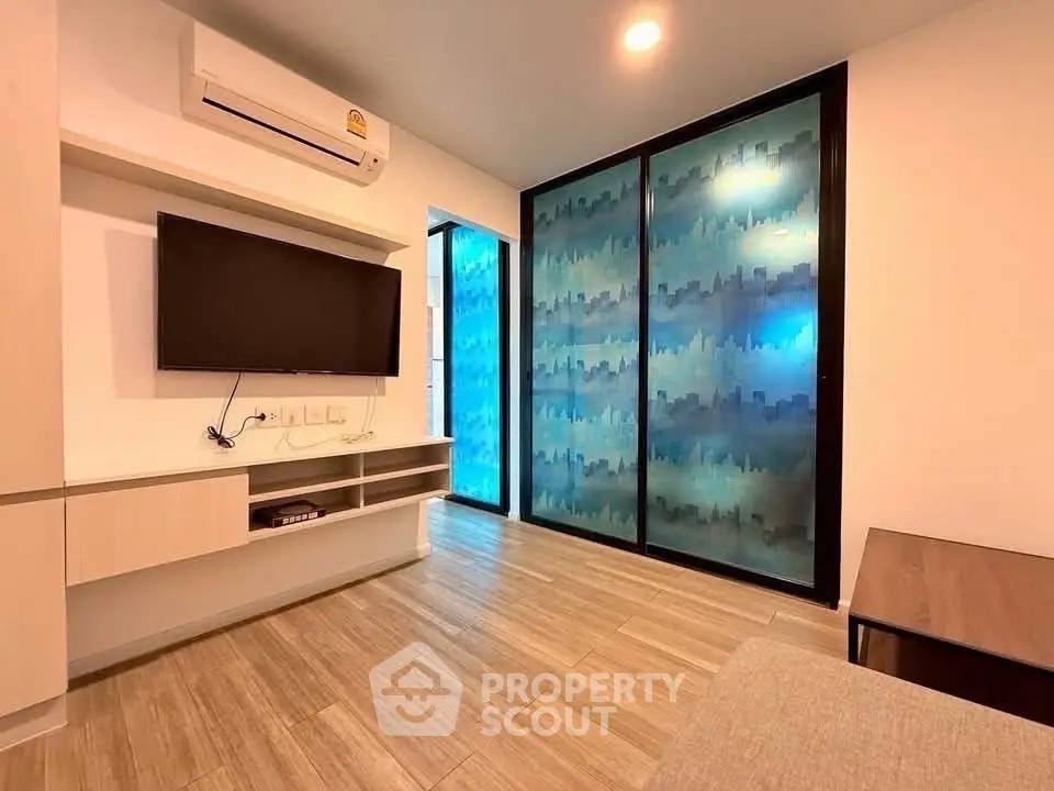 Modern living room with stylish decor and air conditioning
