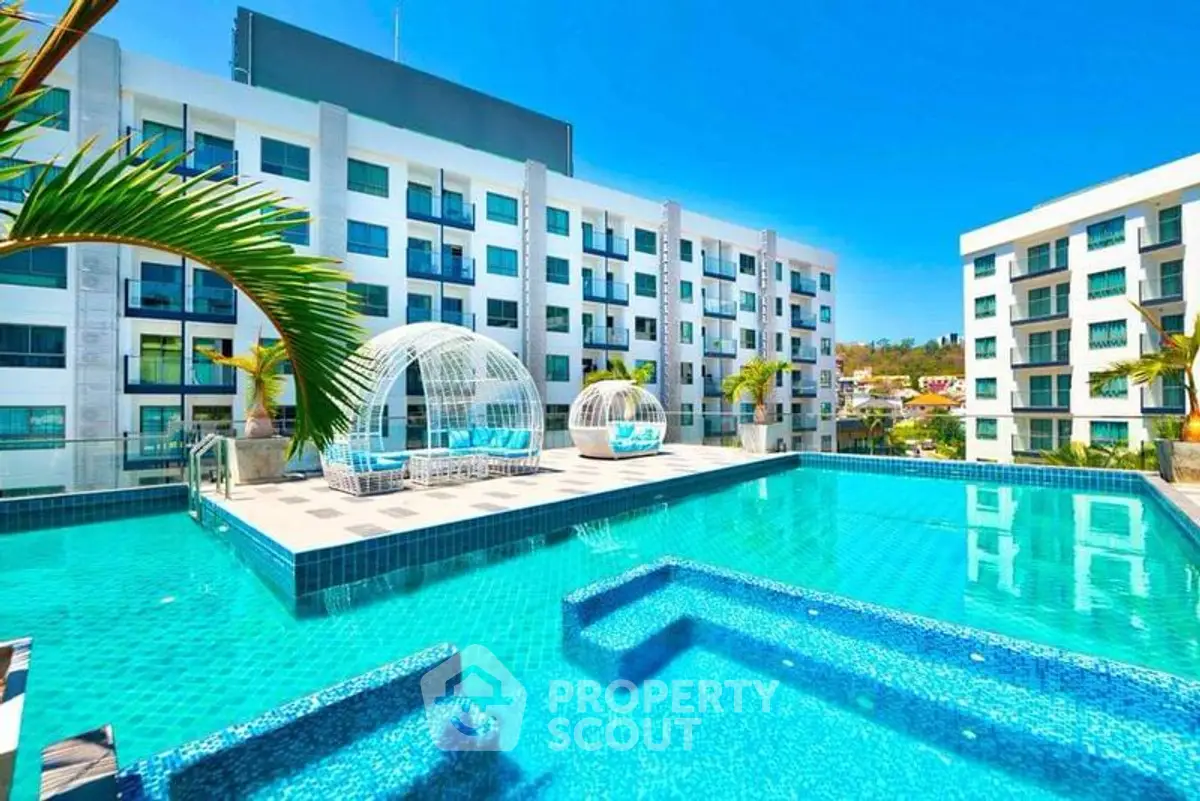 Luxurious apartment complex with stunning pool and modern design.