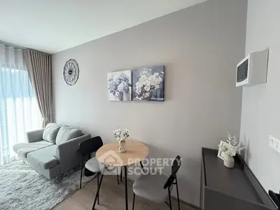 Modern living room with stylish decor and cozy seating area, perfect for relaxation.