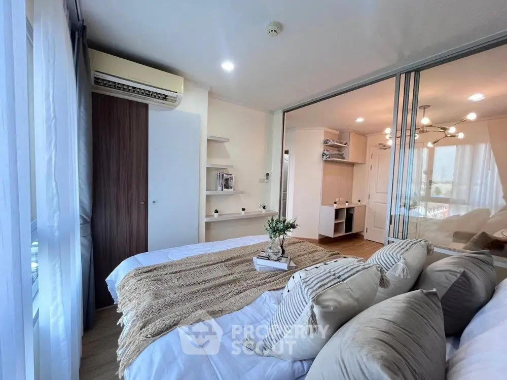 Modern bedroom with stylish decor and ample natural light
