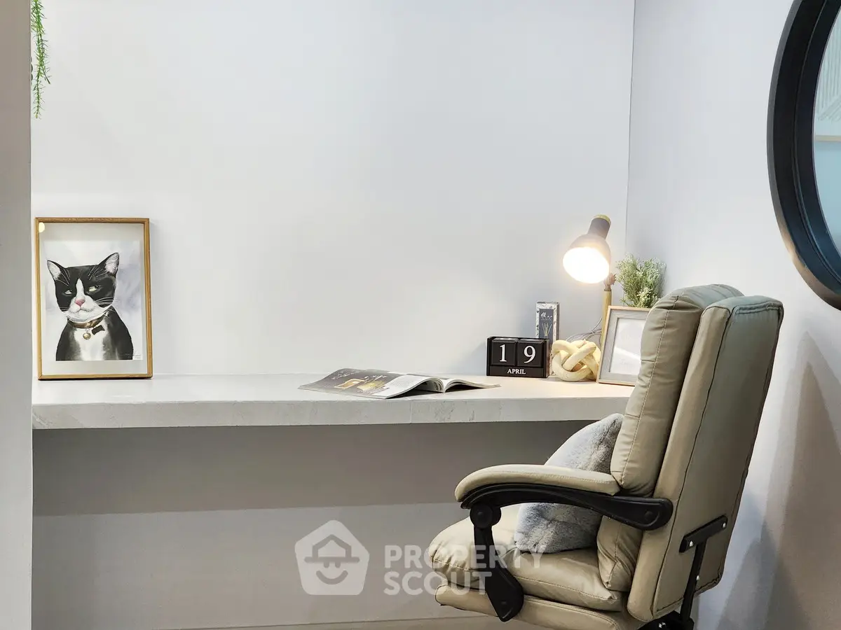 Modern study nook with sleek desk, cozy chair, and stylish decor.