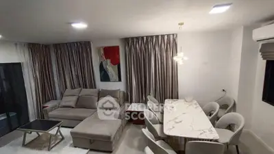 Spacious living room with elegant dining area and modern decor