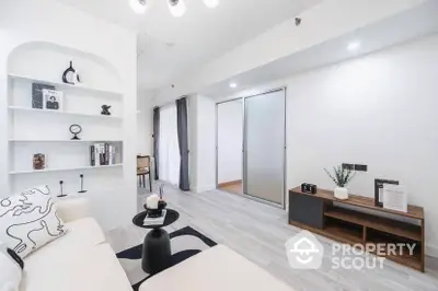 Modern living room with sleek design, white walls, and stylish furniture, perfect for contemporary living.