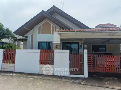 Charming suburban house with modern design and spacious driveway, perfect for family living.