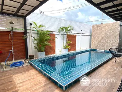 Stunning private pool area with modern design and lush greenery, perfect for relaxation and entertainment.