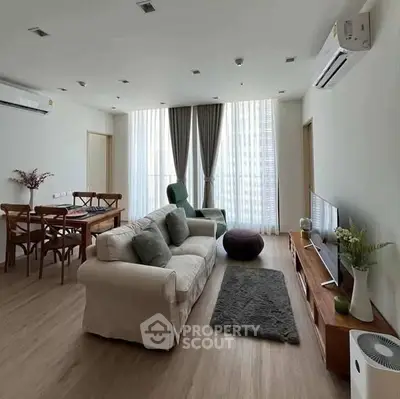 Spacious modern living room with elegant decor and natural light