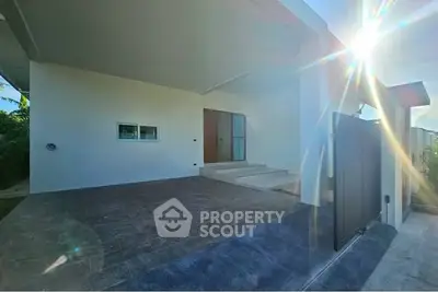 Modern home entrance with sleek design and sunlit ambiance