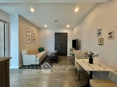 Modern living room with elegant decor and cozy seating area, perfect for relaxation and entertainment.