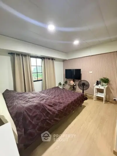 Cozy bedroom with modern decor and natural light