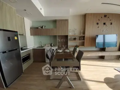 Modern kitchen and dining area with sleek wooden cabinets and stylish decor