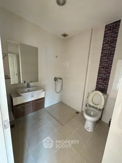 Modern bathroom with sleek fixtures and stylish tile accents