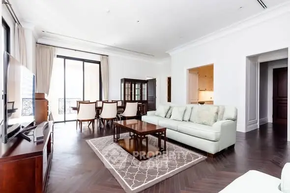 Spacious and elegant living room with modern furniture and large windows.