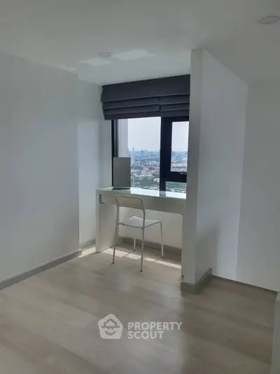 Modern study nook with city view in high-rise apartment