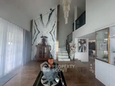 Luxurious modern living room with high ceilings and elegant decor