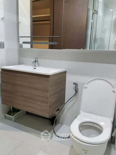 Modern bathroom with sleek fixtures and elegant wood accents