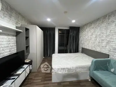 Modern bedroom with stylish brick walls and cozy furnishings in a contemporary apartment.