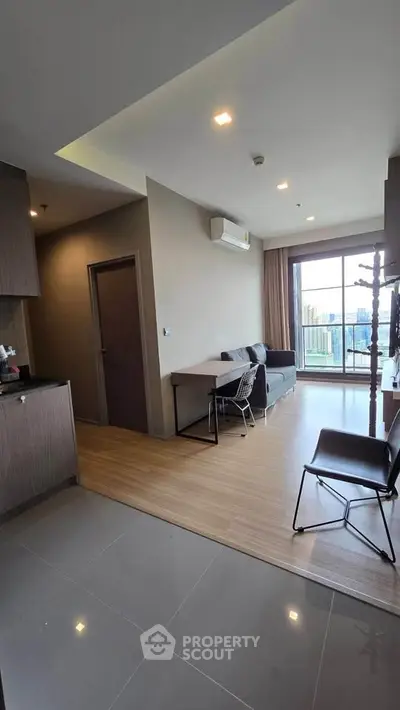 Modern living room with balcony view in stylish apartment