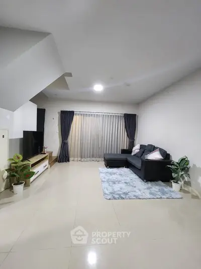 Spacious modern living room with sleek furniture and elegant decor
