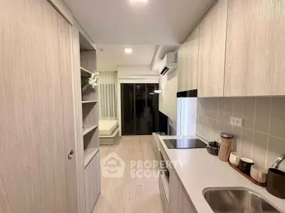 Modern kitchen with sleek cabinetry and open layout in stylish apartment