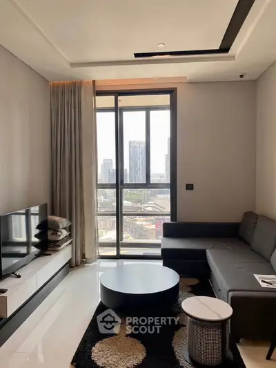 Modern living room with city view, sleek furniture, and large windows in a high-rise apartment.