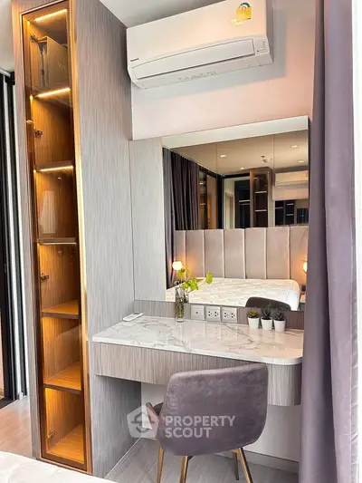 Modern bedroom with stylish vanity and elegant decor