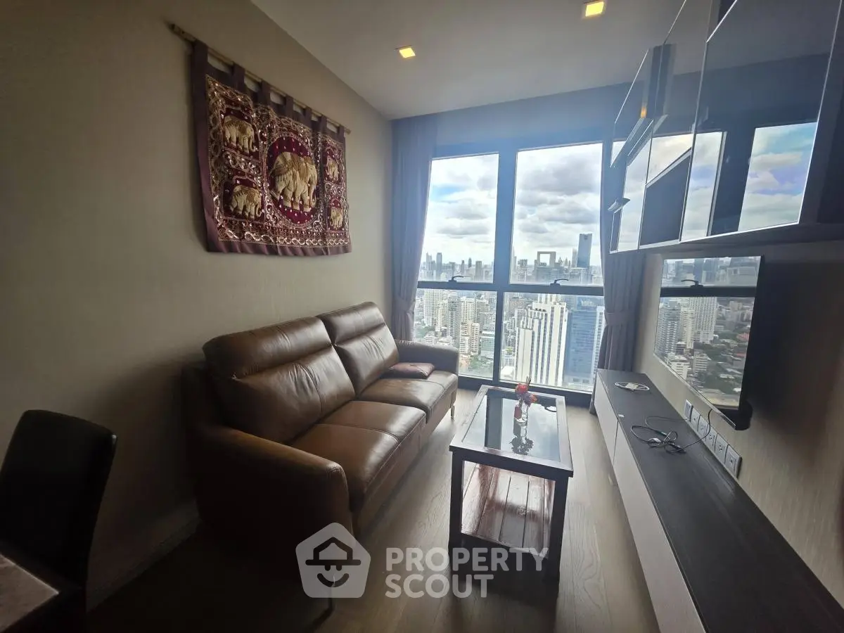 Modern living room with stunning city view and elegant decor in high-rise apartment.