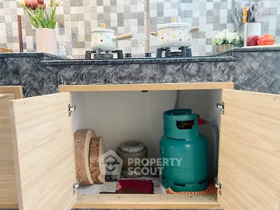 Modern kitchen with gas stove and stylish backsplash