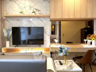 Modern living room with marble accents and sleek TV setup