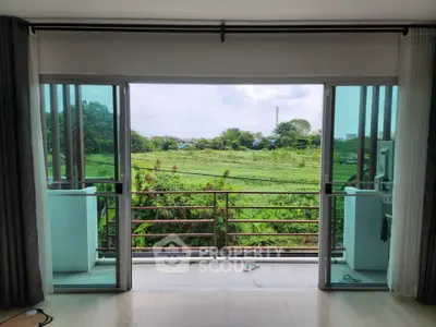 Spacious balcony with stunning green view, perfect for relaxation and enjoying nature.