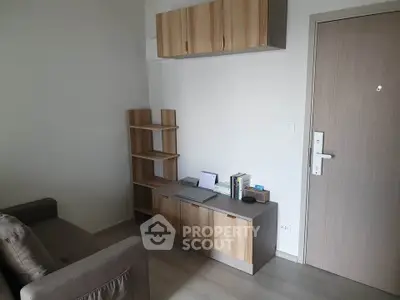 Modern living room with stylish wooden furniture and cozy sofa in a contemporary apartment.