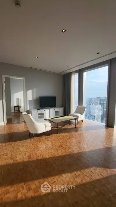Spacious living room with city view and elegant parquet flooring