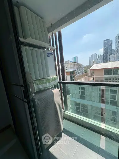Charming balcony with city view, perfect for relaxation and enjoying urban skyline.