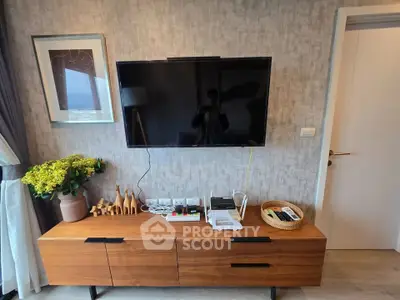 Modern living room with wall-mounted TV and stylish wooden console