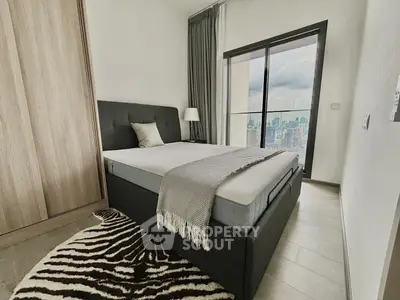 Modern bedroom with city view and stylish decor