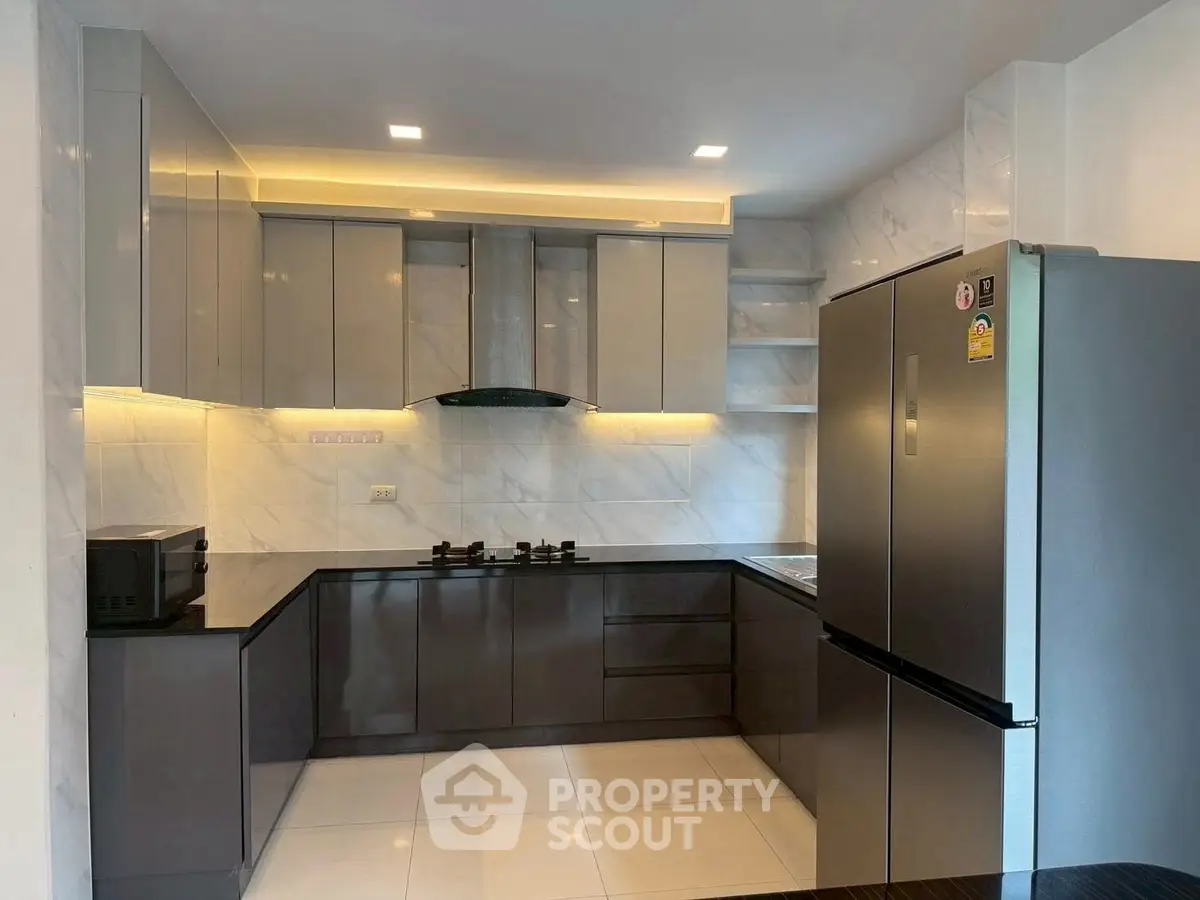 Modern kitchen with sleek cabinets and stainless steel appliances