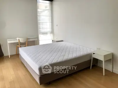 Spacious bedroom with minimalist design and natural light