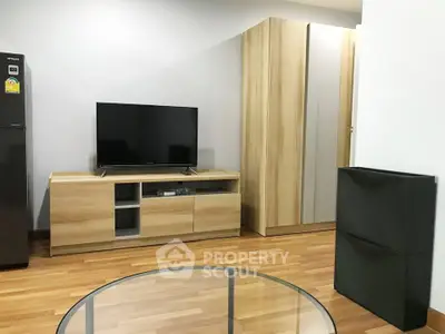 Modern living room with wooden furniture and sleek TV setup
