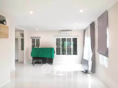 Spacious living room with bright natural light and modern decor