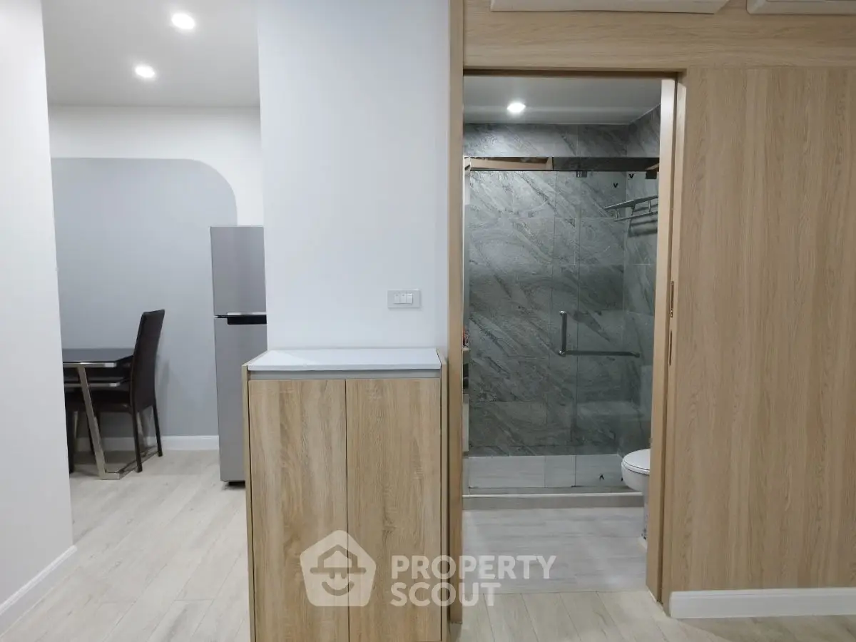 Modern apartment interior with sleek bathroom and dining area