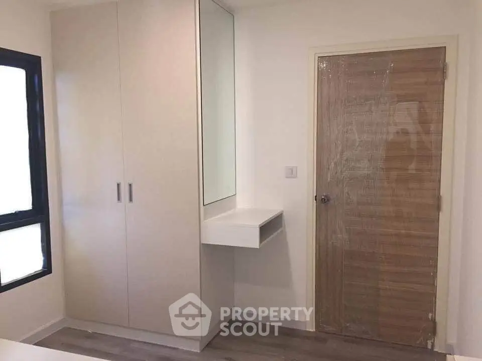 Modern bedroom with sleek wardrobe and minimalist design